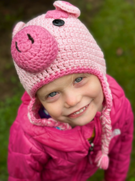 Ella wearing a pig beanie
